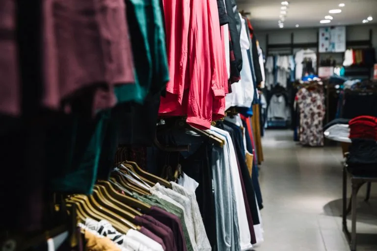 rows hangers with clothes